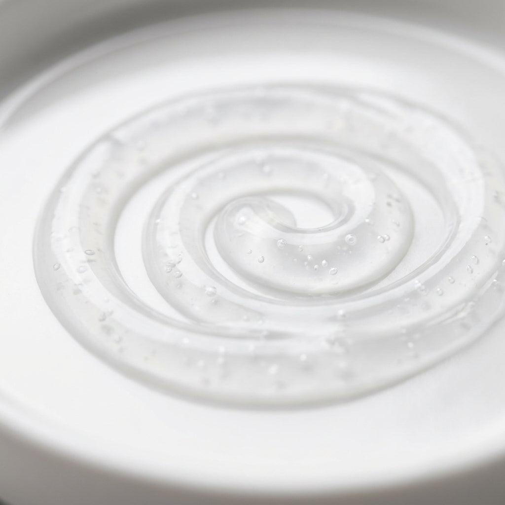 Macro close-up of a clear exfoliating scalp serum gel