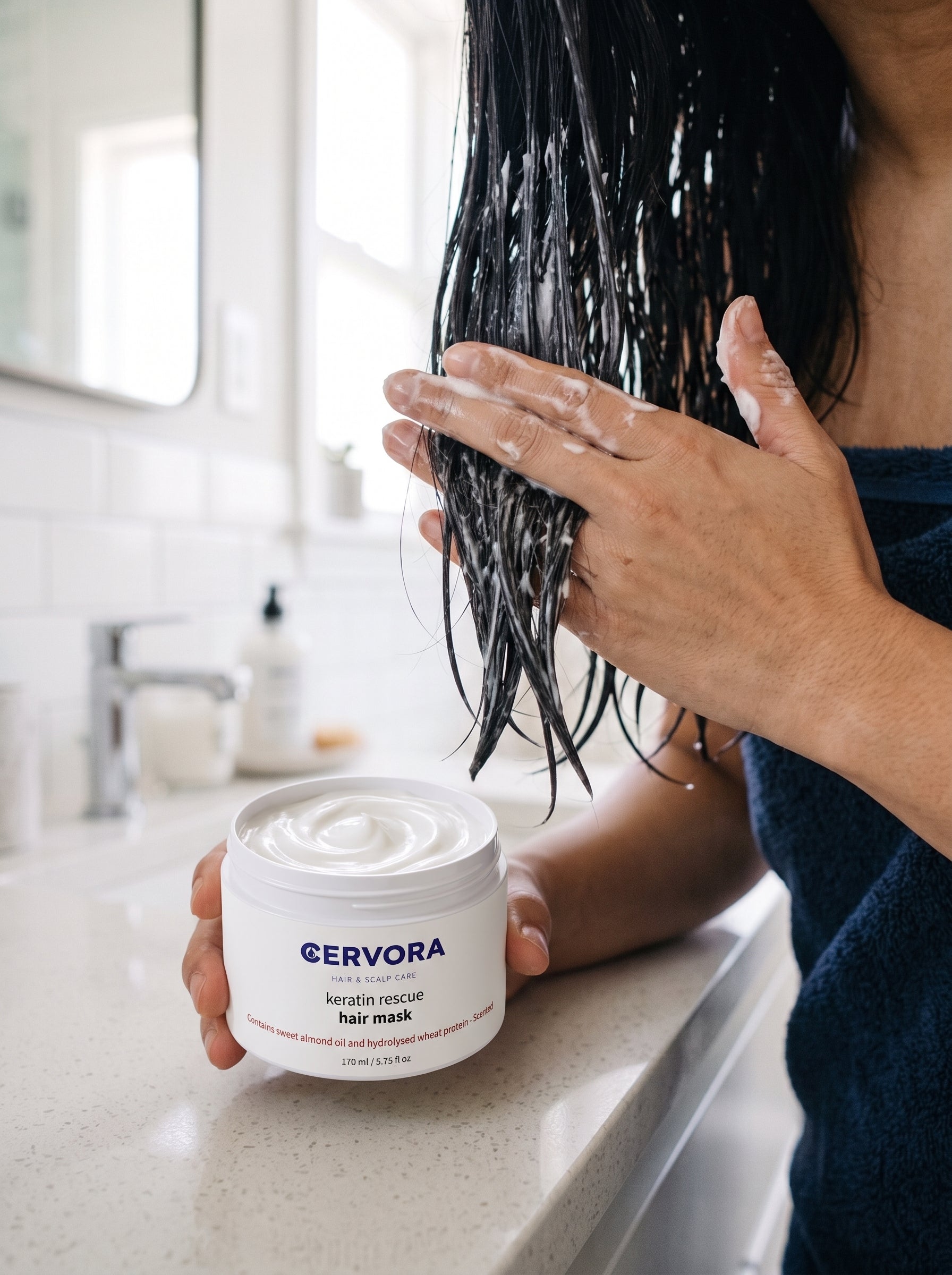 Applying Keratin Rescue Hair Mask to damp hair